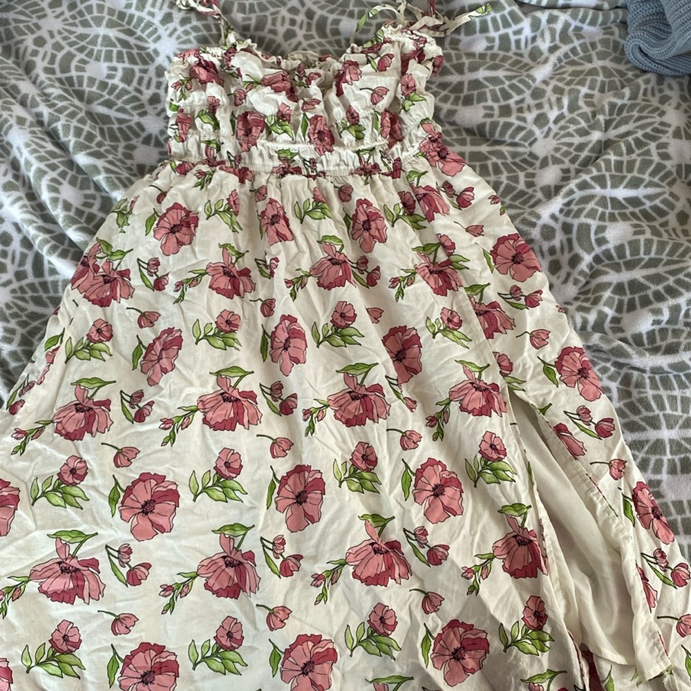 White floral dress with small slit on the leg and ribbon straps